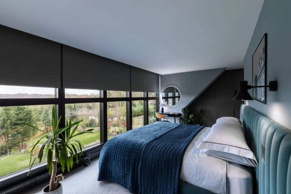 Bedroom with automated Lutron blinds